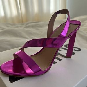 Crafted of eye-catching metallic leather, with a curved vamp strap.